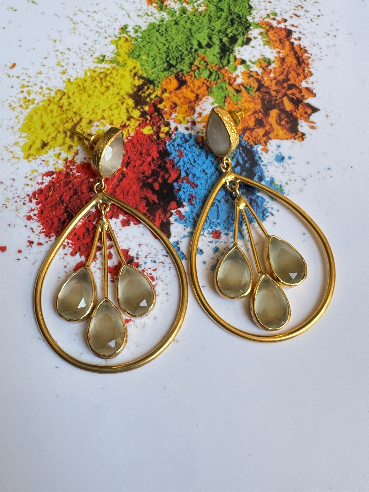 Three-stone white drop earrings