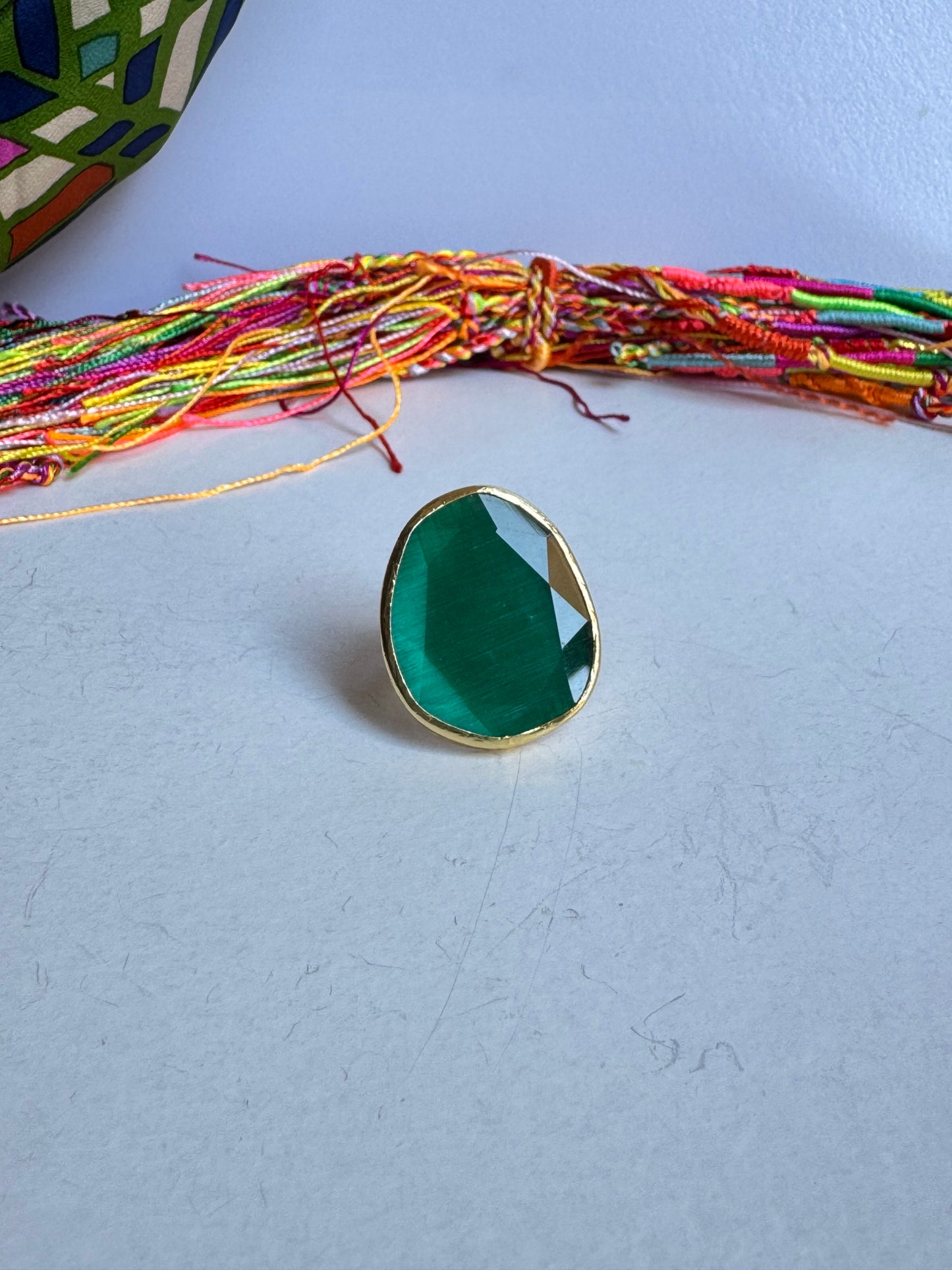 Golden ring drop green bottle