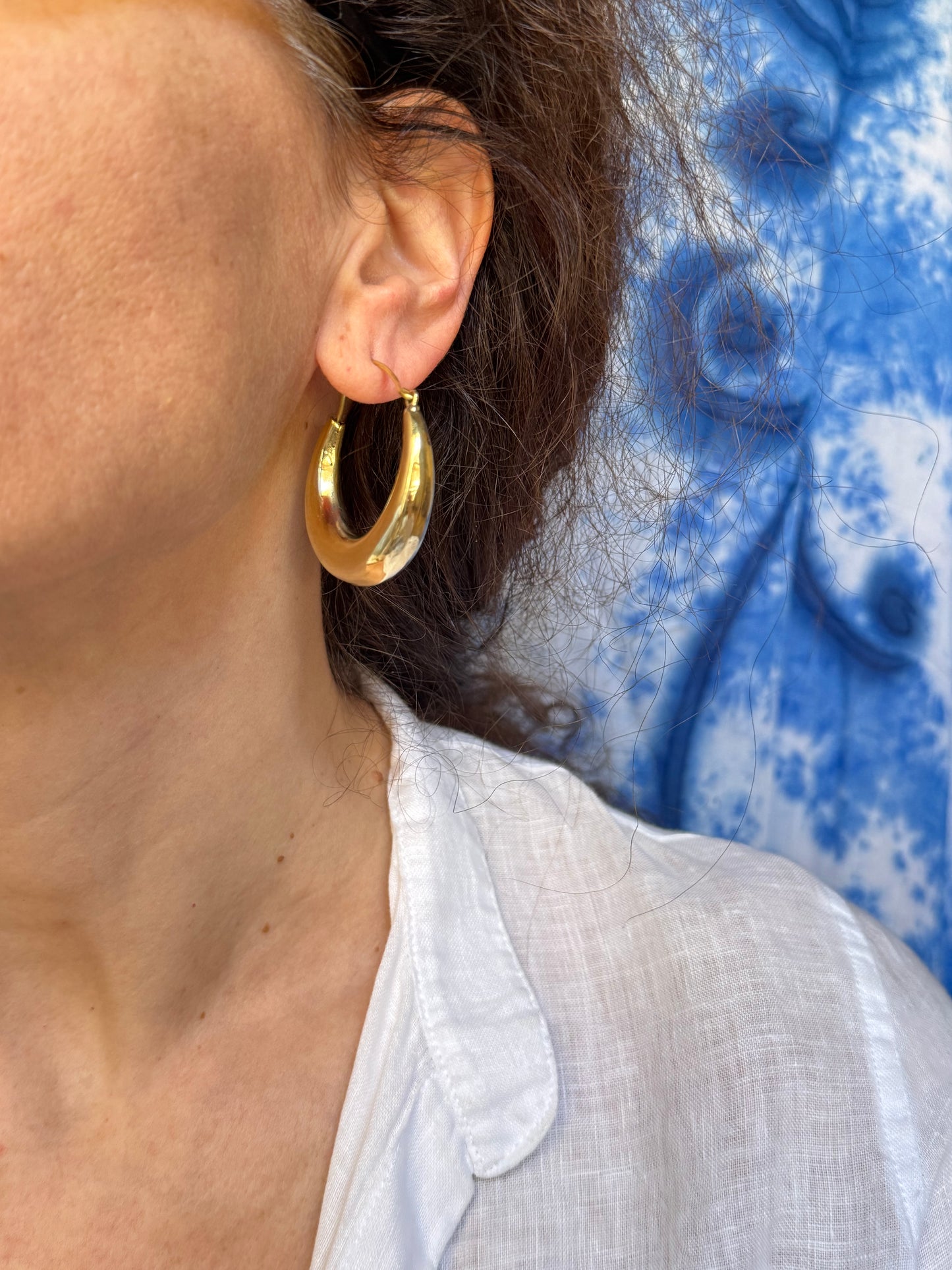 Large rounded golden boho earrings
