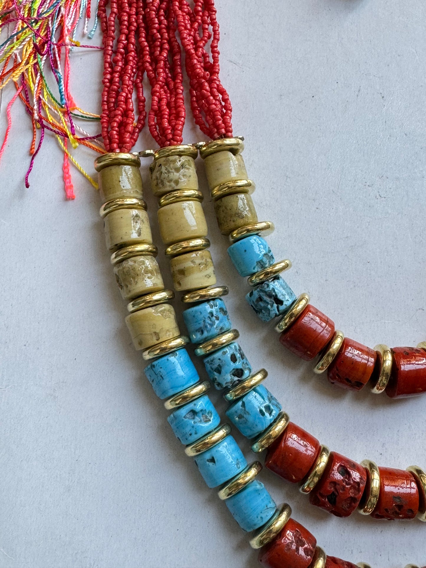 Multi-strand red beaded necklace