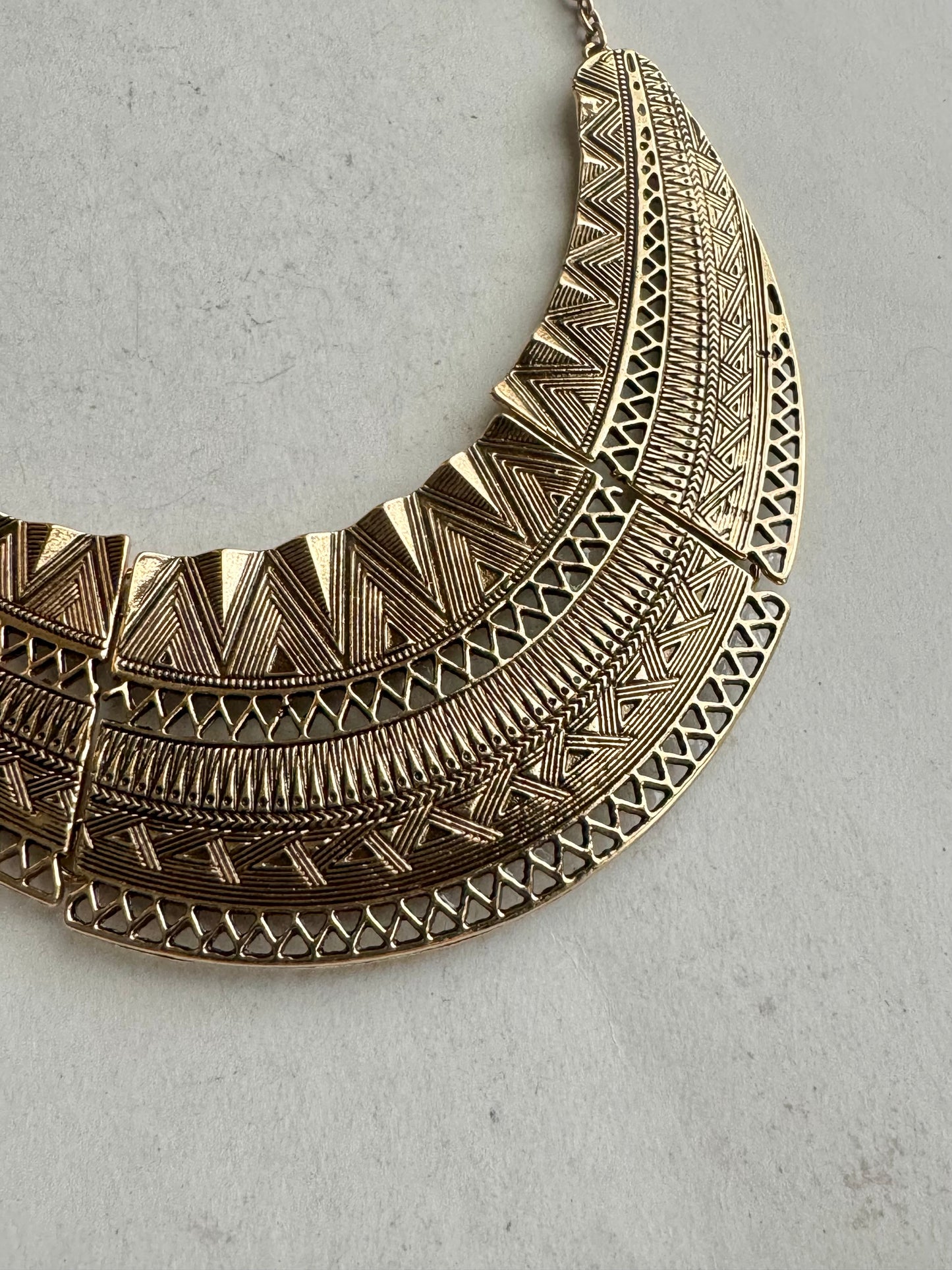 Golden engraved bib necklace