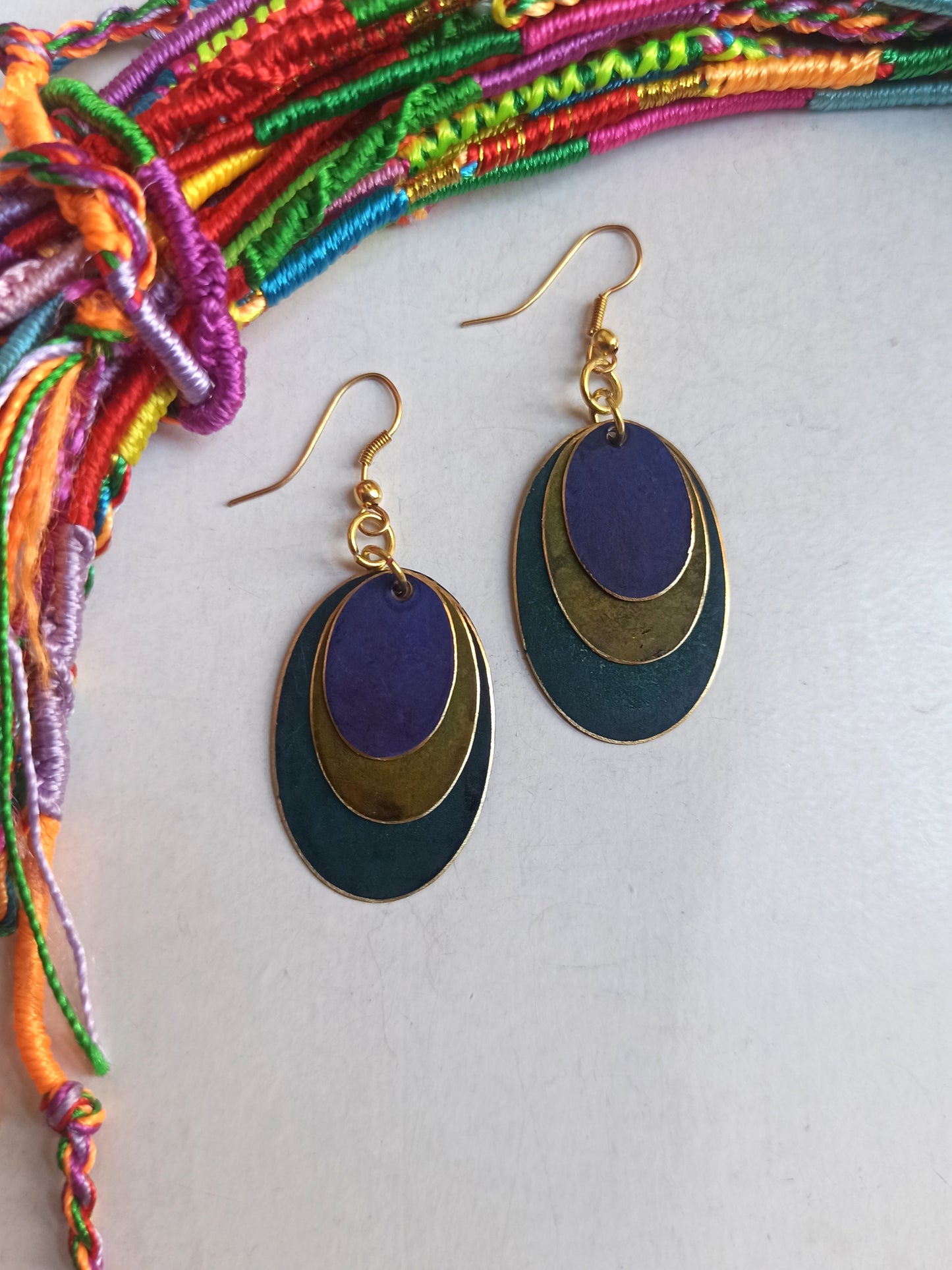 Green and purple oval golden earrings