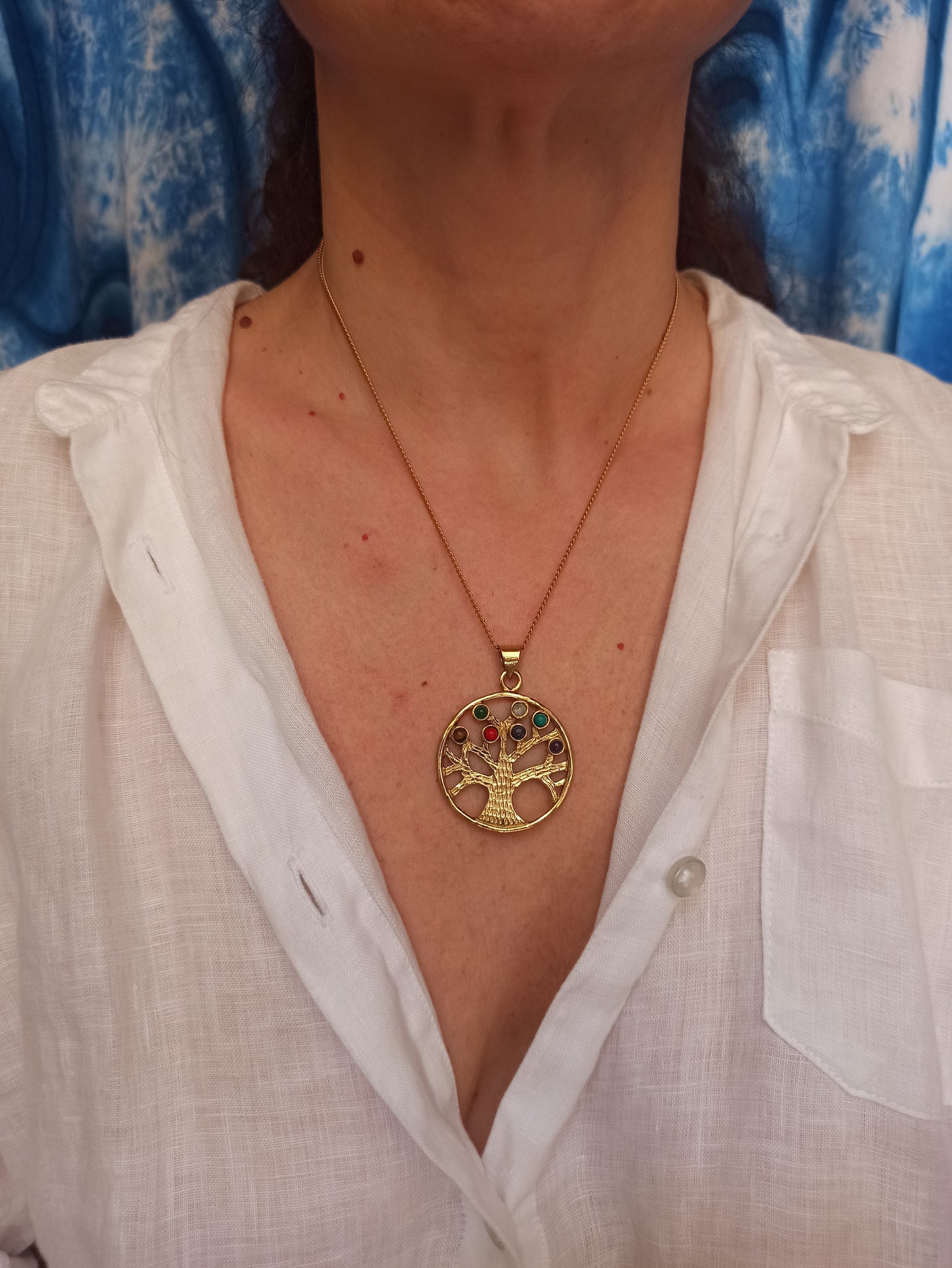 Golden necklace with seven chakra tree of life pendant