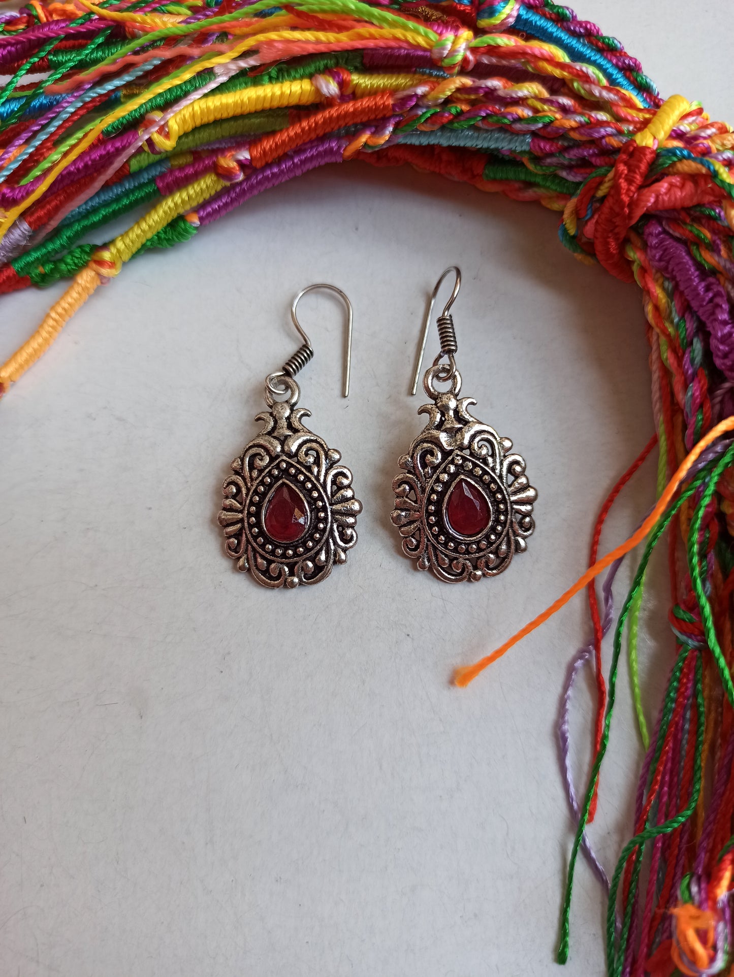 Silver boho drop earrings with red decoration