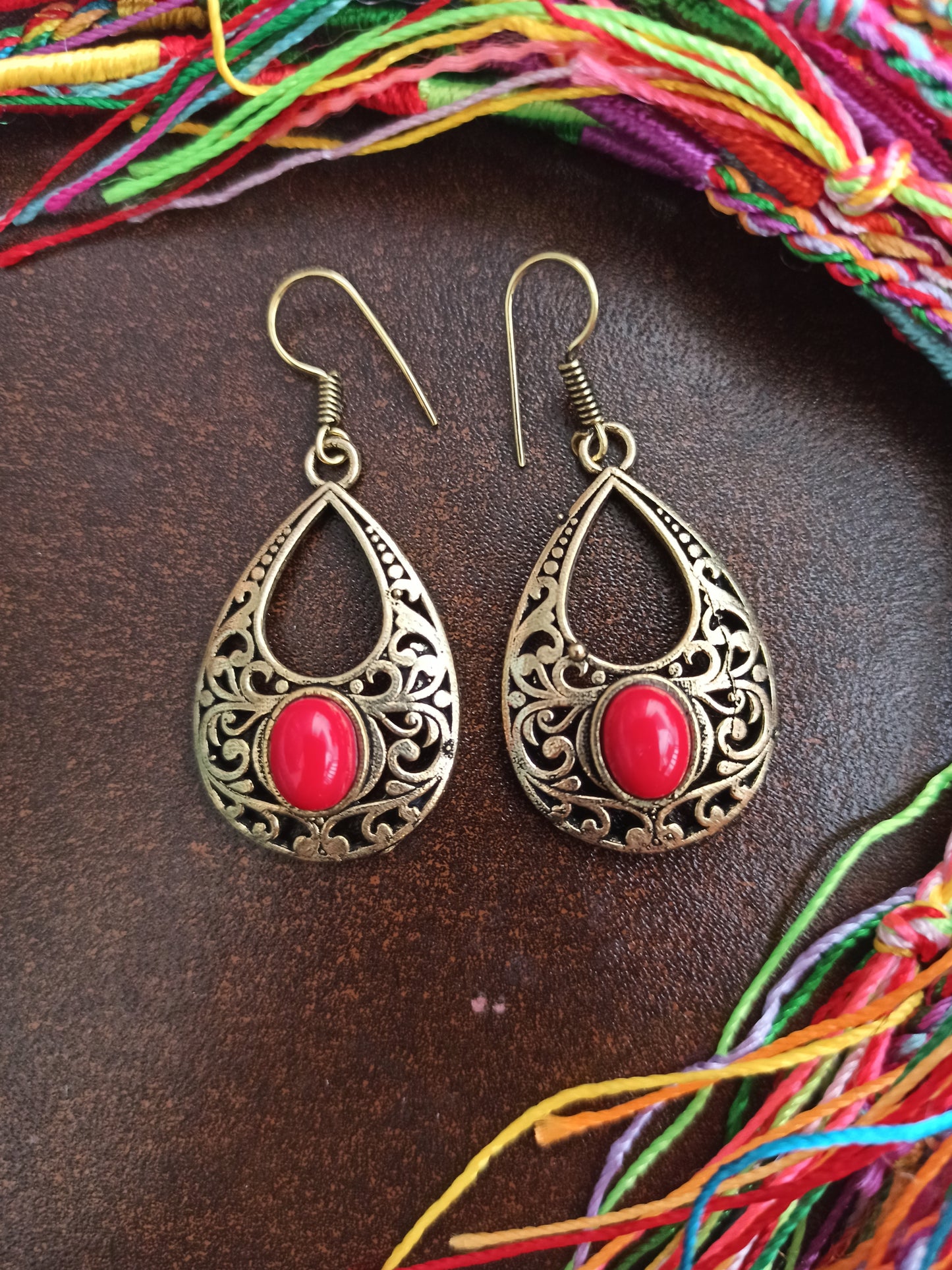 Golden boho earrings with red pierced drop