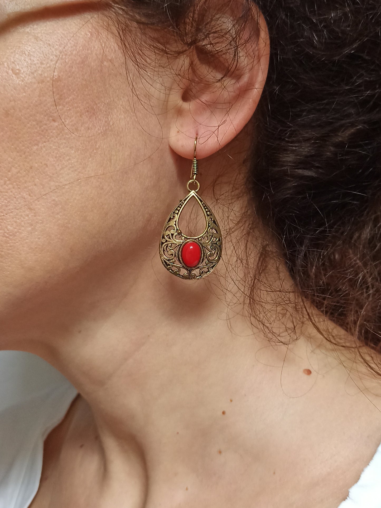 Golden boho earrings with red pierced drop