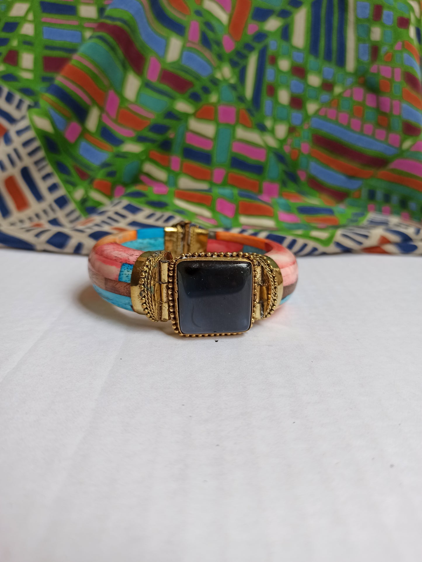 Large multicolored rigid bracelet with shaded black insert