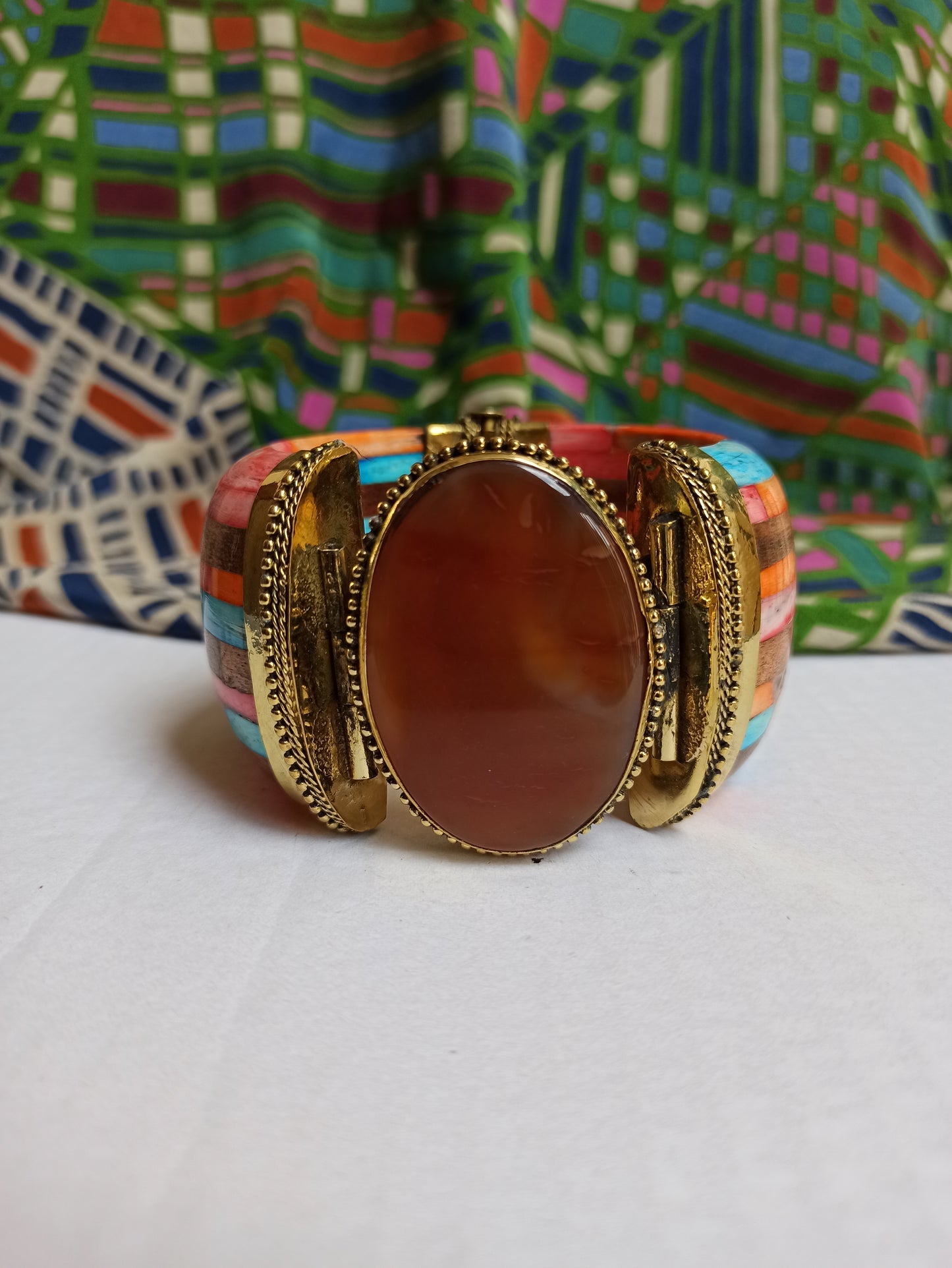 Large multicolored rigid bracelet with amber insert