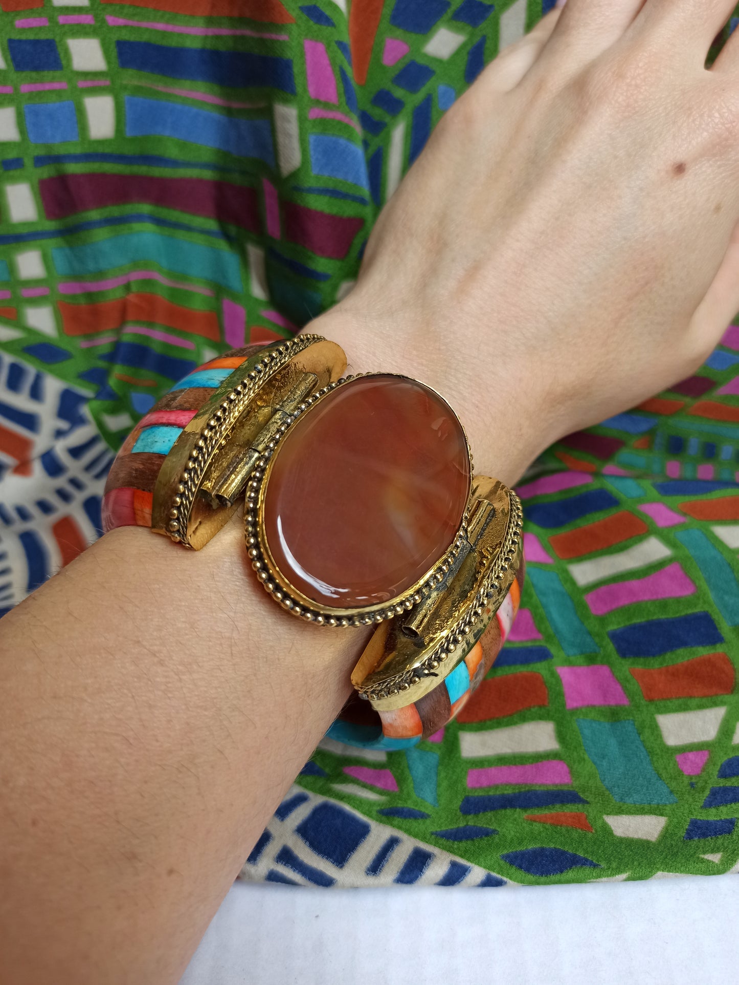 Large multicolored rigid bracelet with amber insert