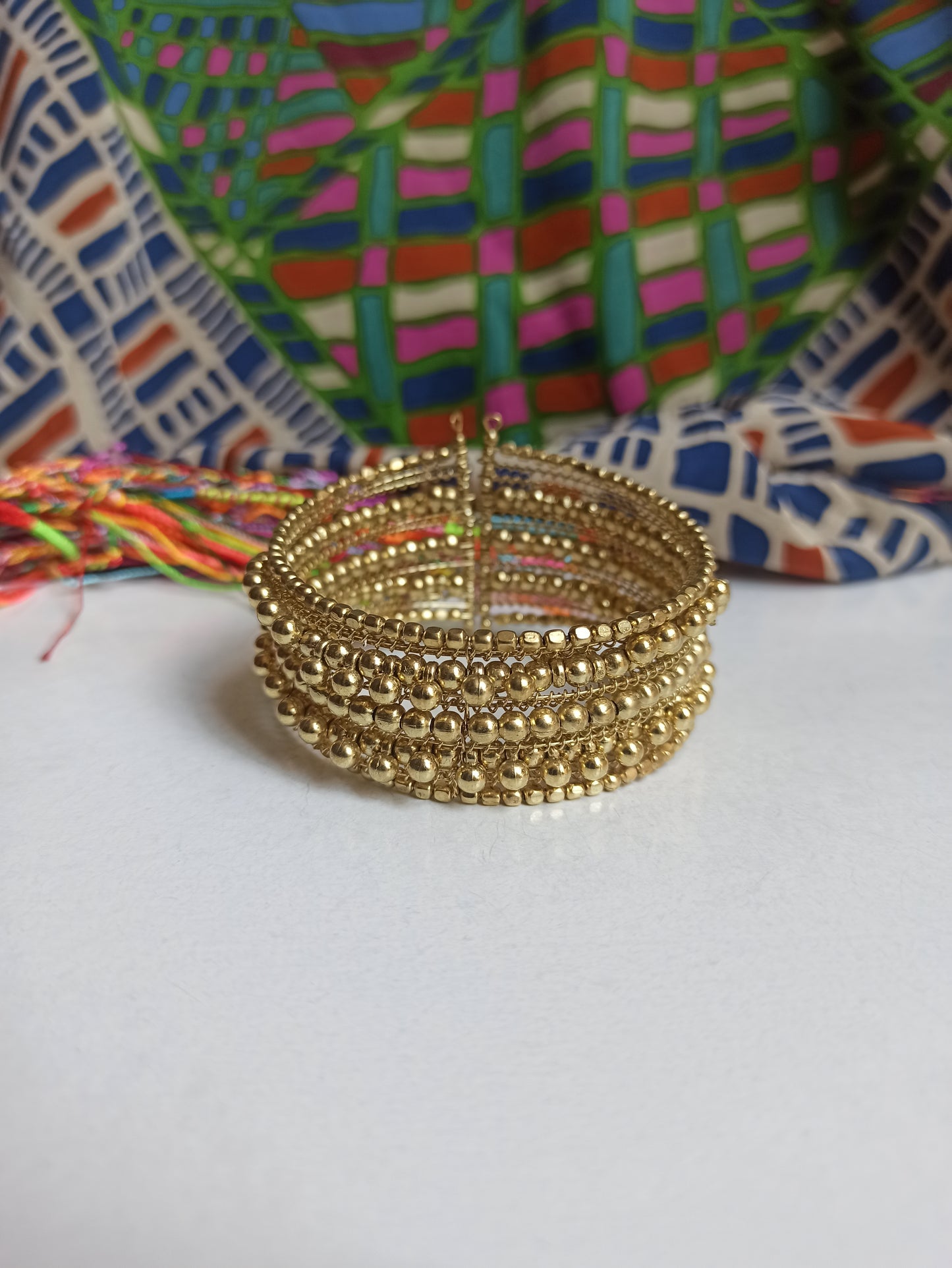 Multi-strand golden ball bracelet