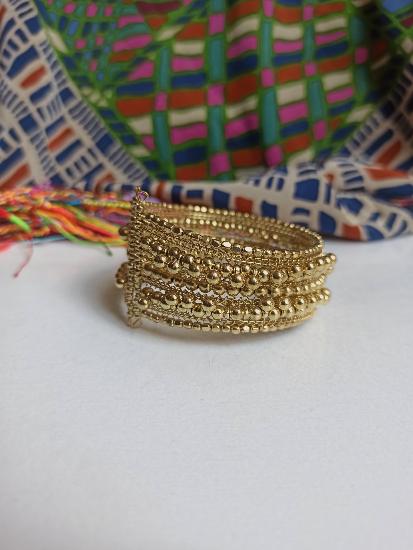 Multi-strand golden ball bracelet