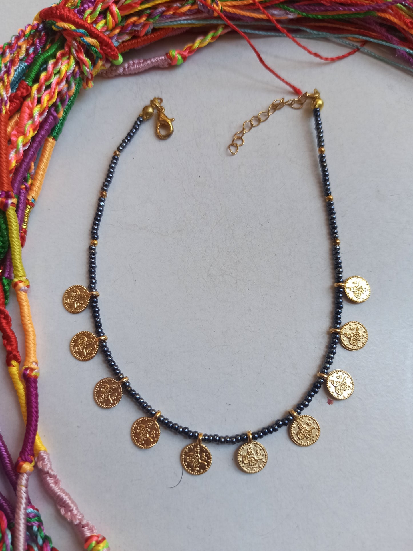 Anthracite beaded anklet + golden coins