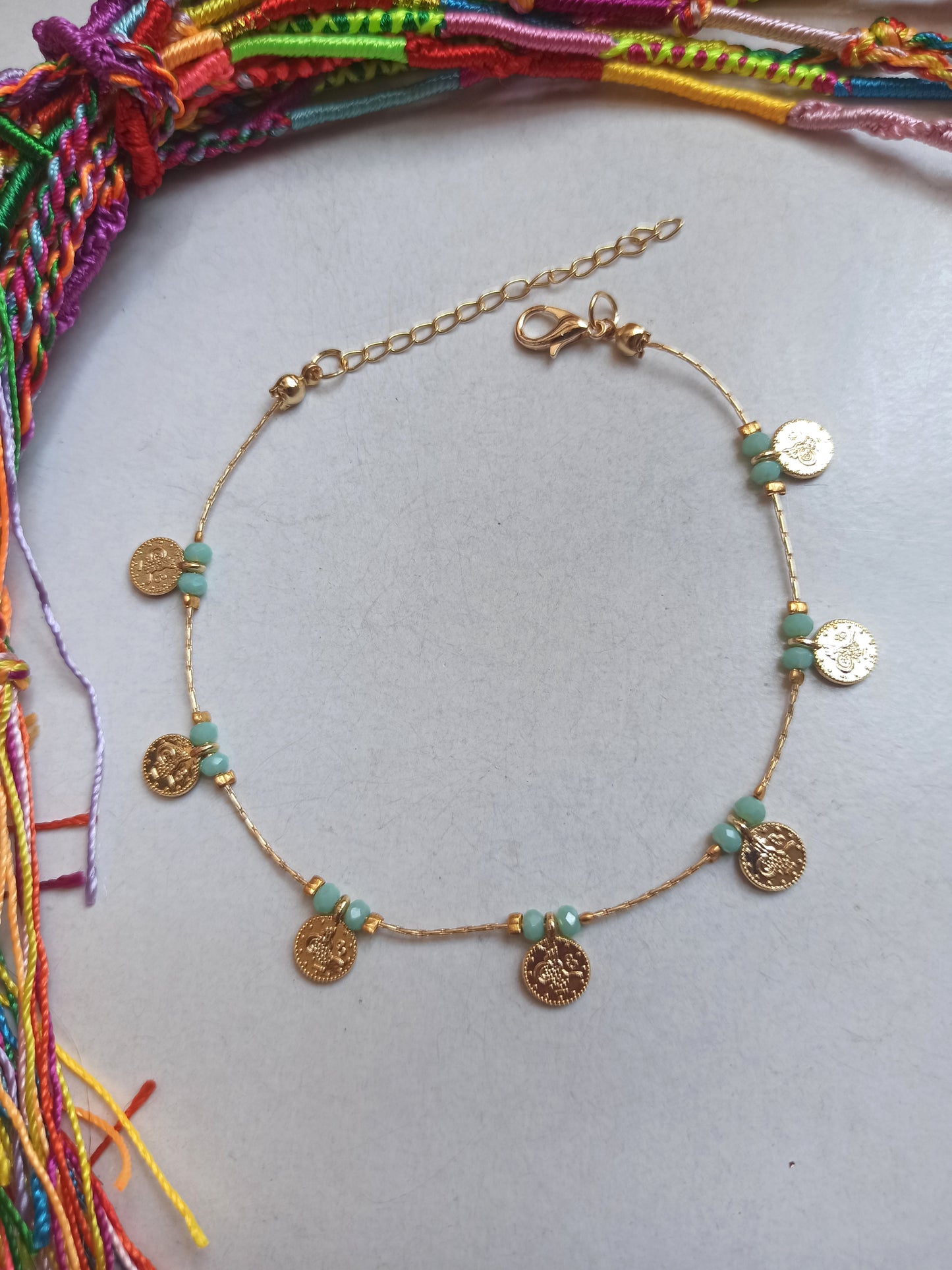 Anklet with light blue sea beads + golden coins