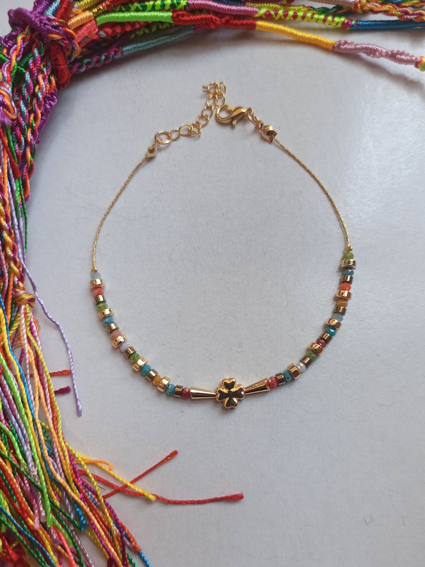 Golden multicolored four-leaf clover anklet