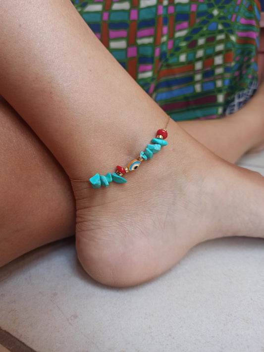 Golden anklet with turquoise eye