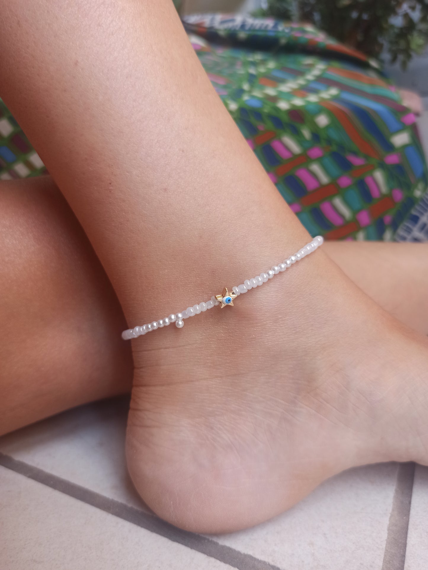 Golden star anklet with white beads