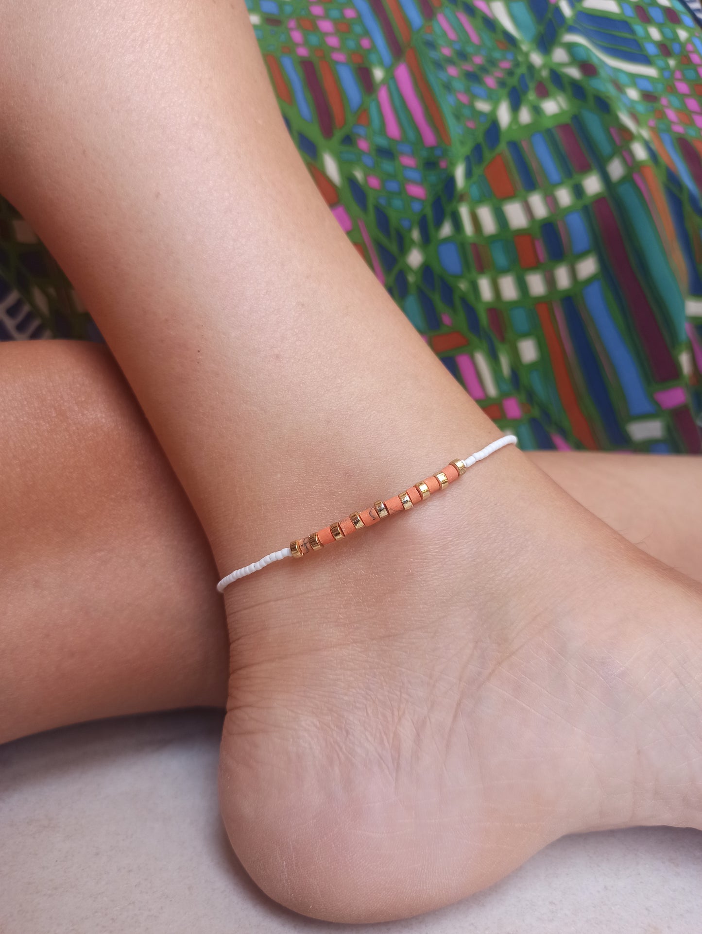 Orange and white beaded anklet