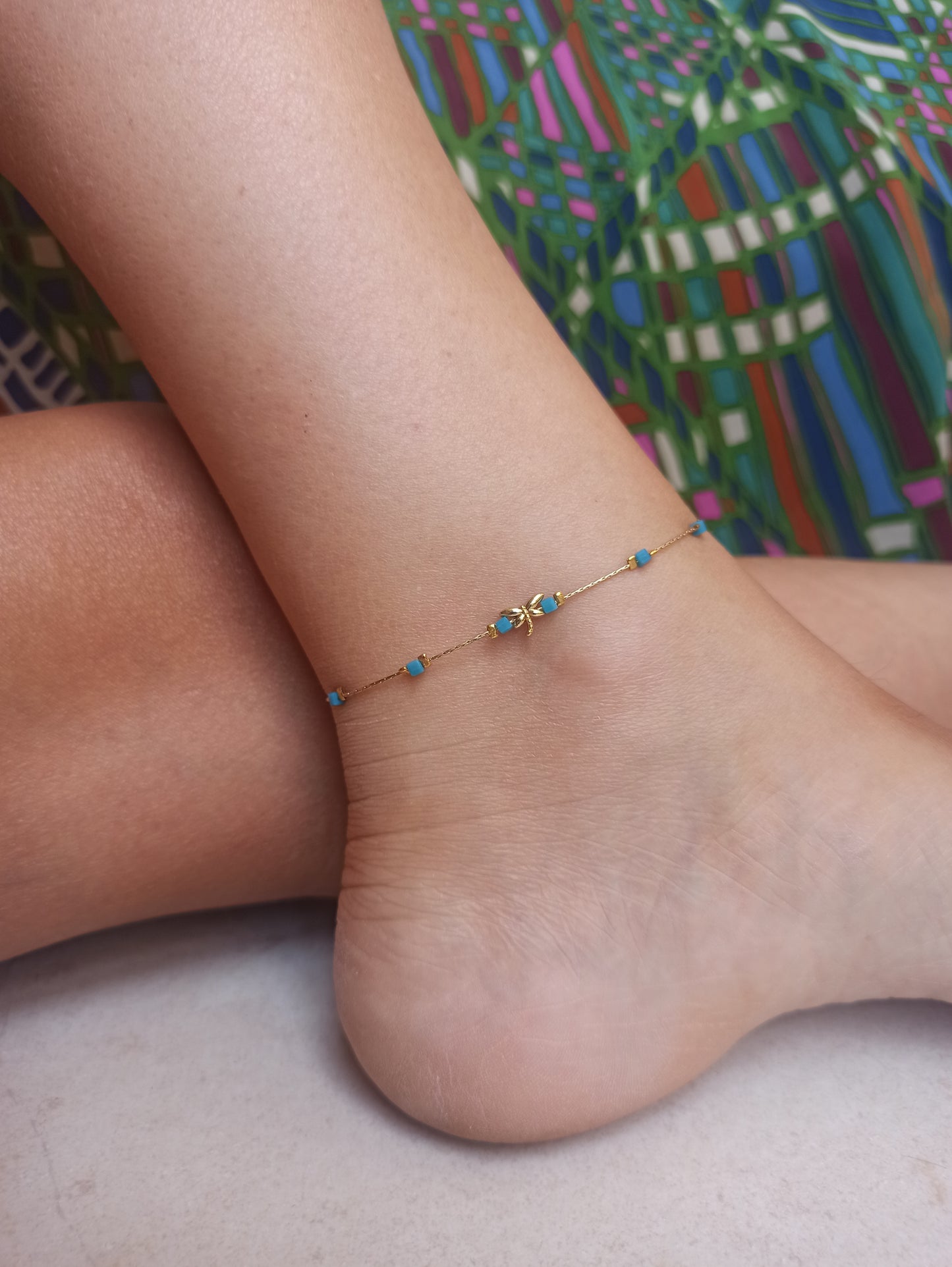 Golden dragonfly anklet with light blue beads