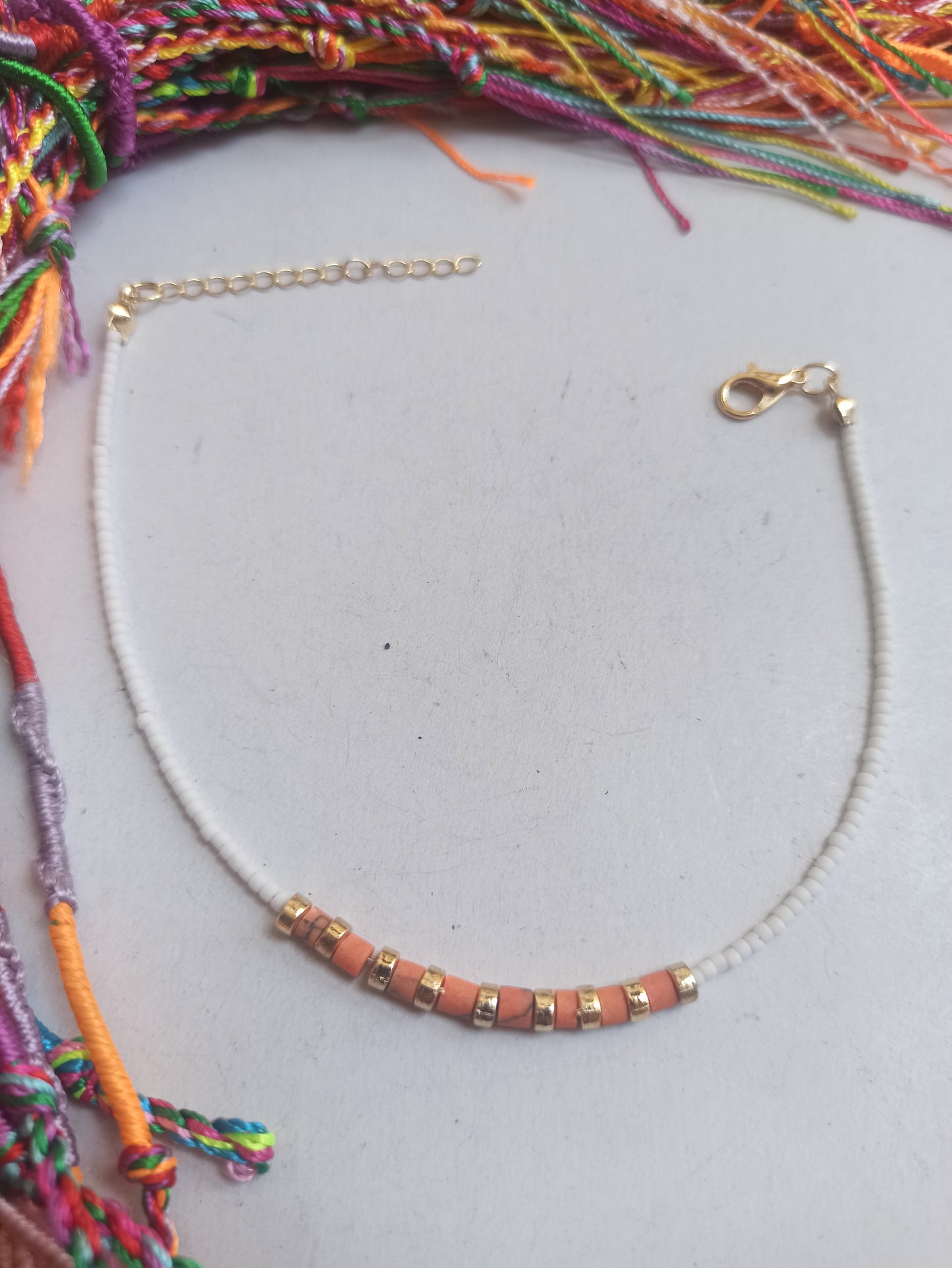 Orange and white beaded anklet