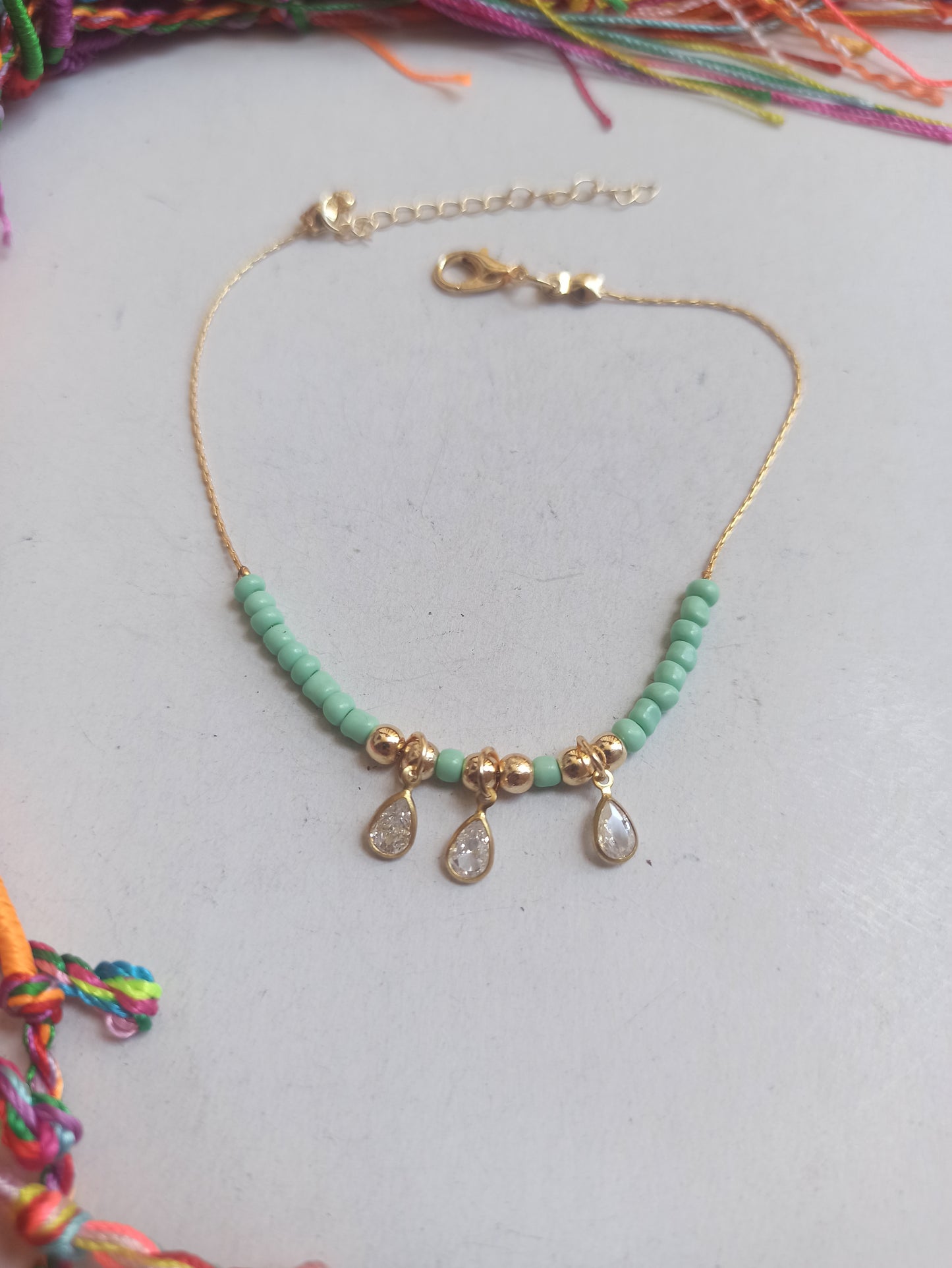 Golden anklet 3 lights green beads