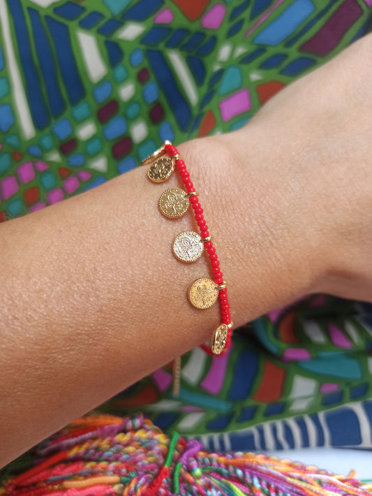 Thin beaded bracelet with red coins