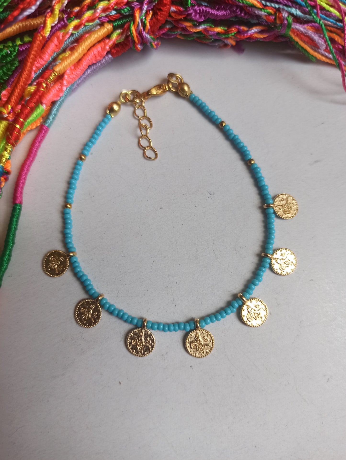 Thin bracelet with turquoise coin beads