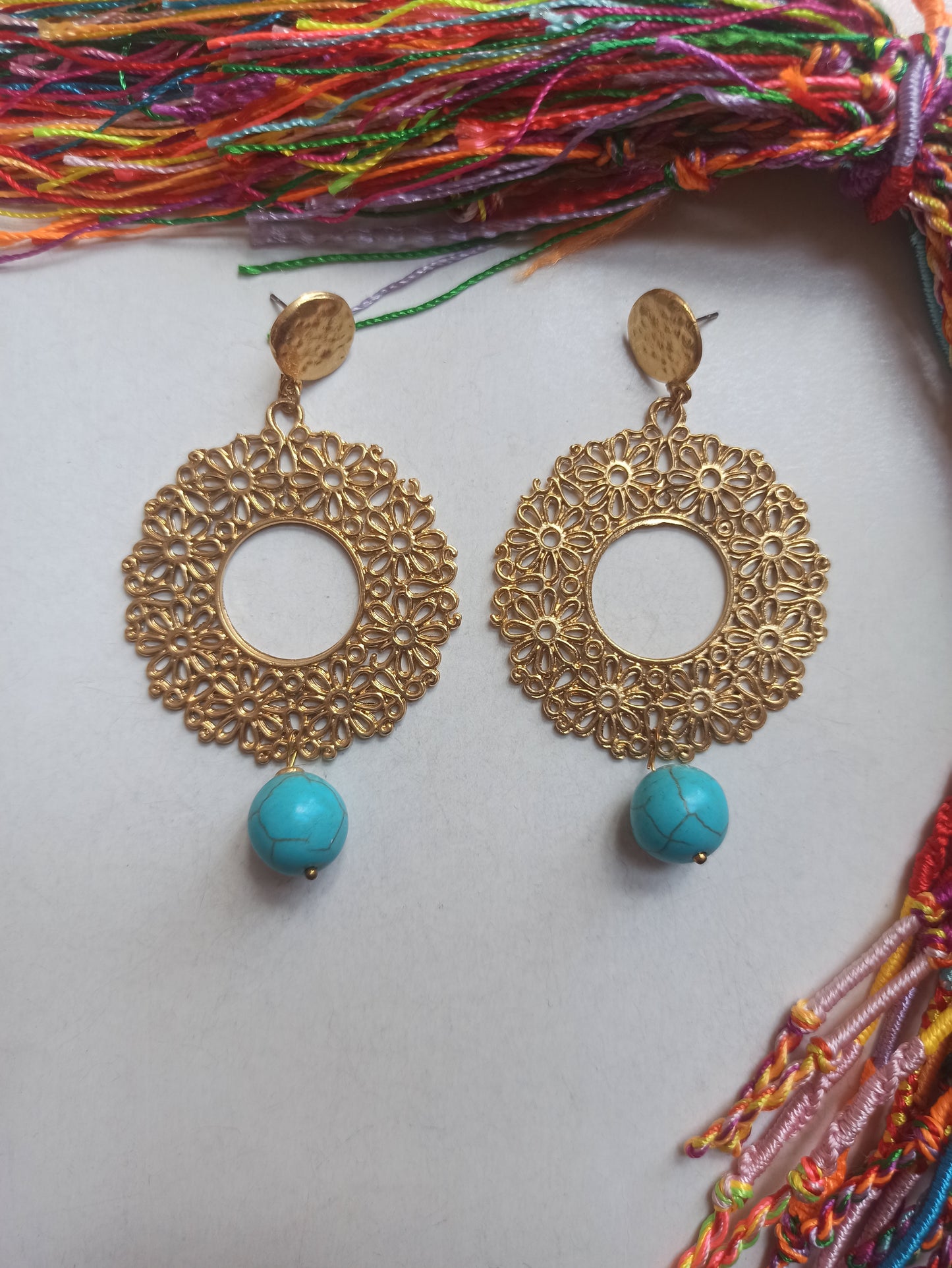 Golden earrings with turquoise bead flowers