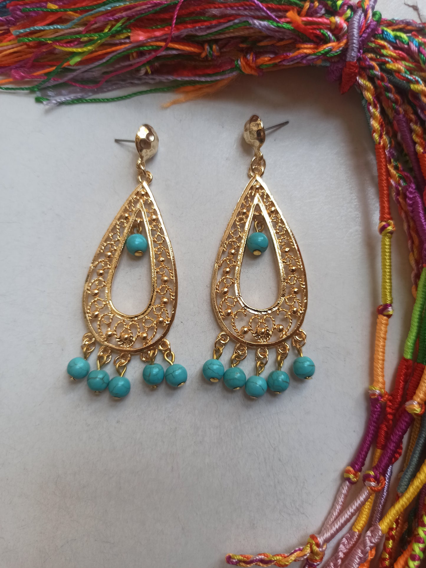 Golden drop earrings with turquoise beads