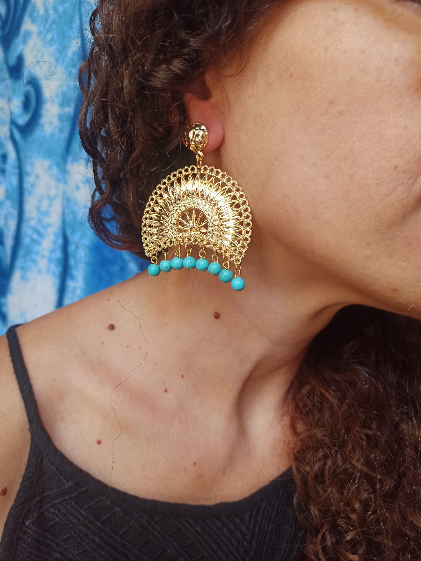 Golden bow earrings with turquoise beads