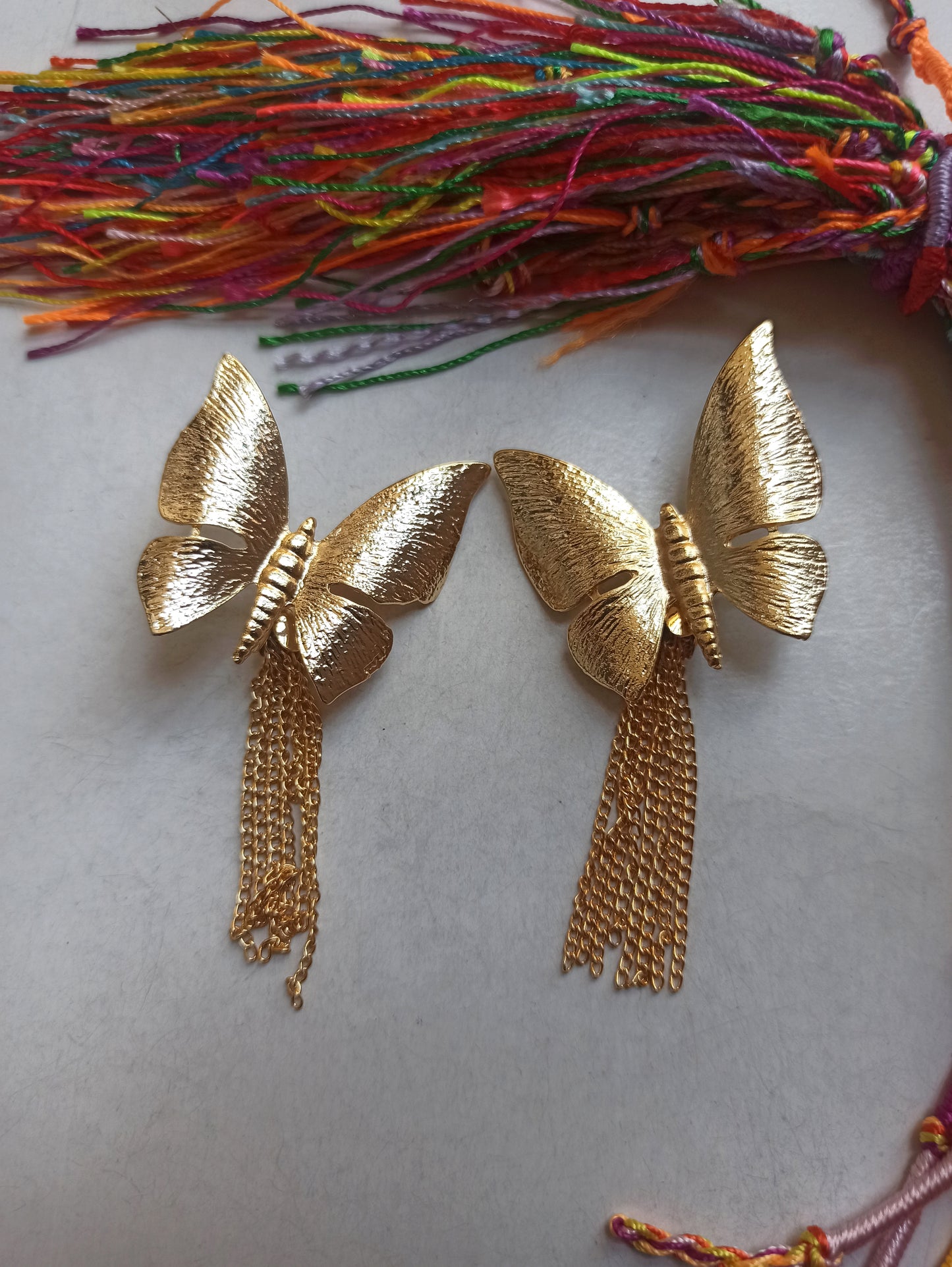 Golden butterfly dangling earrings