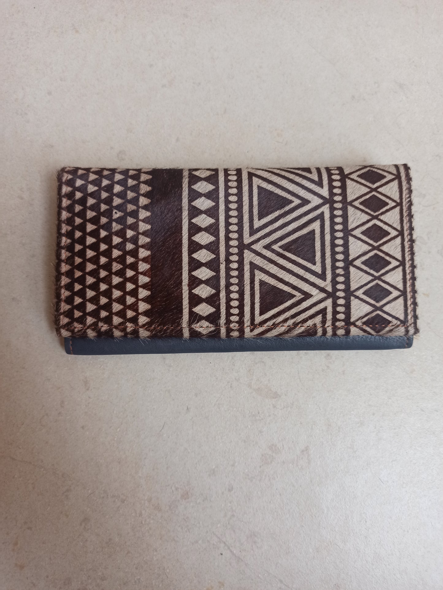 Leather wallet with fur decoration