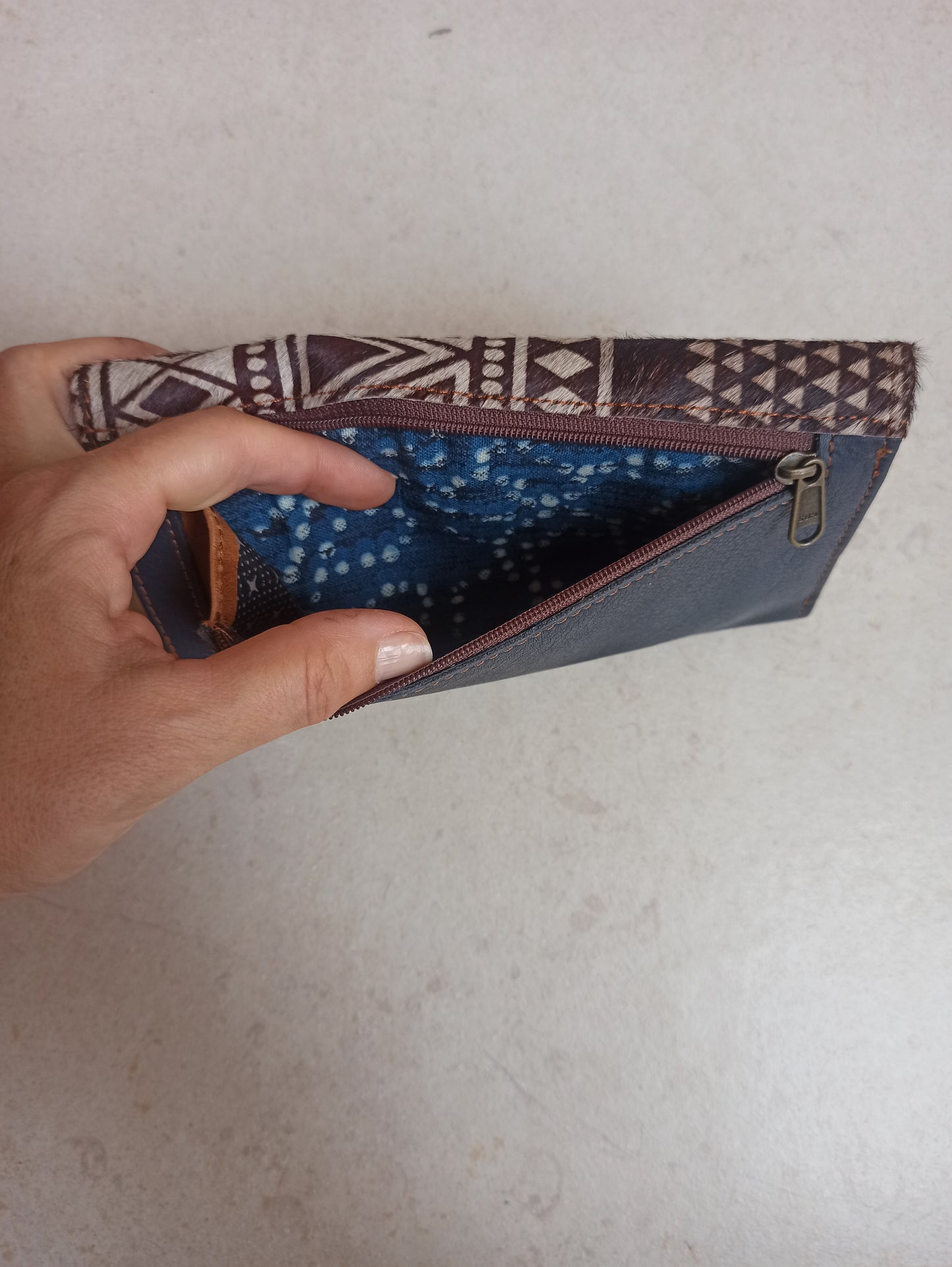 Leather wallet with fur decoration