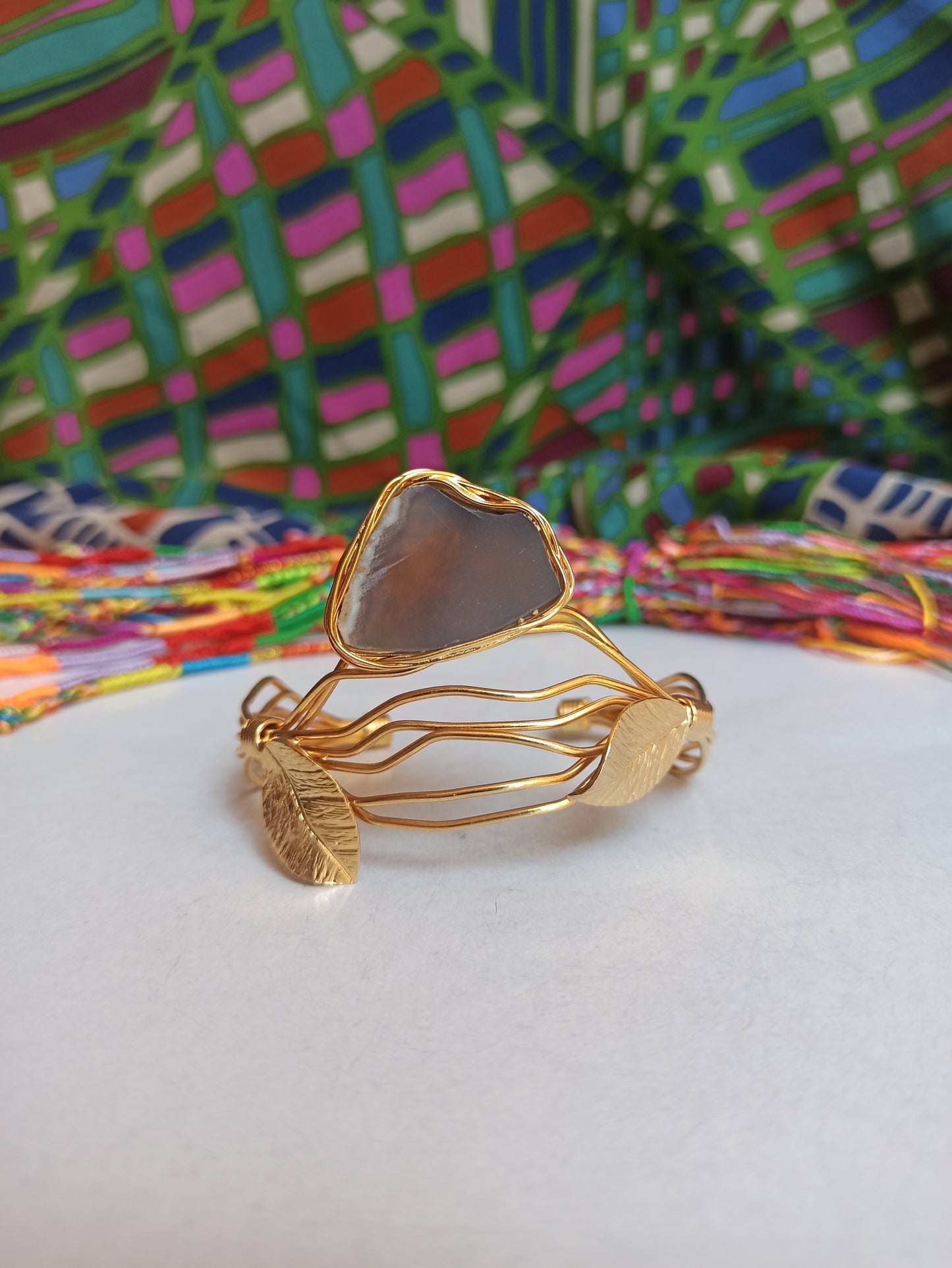 Golden bracelet with light lilac agate leaves