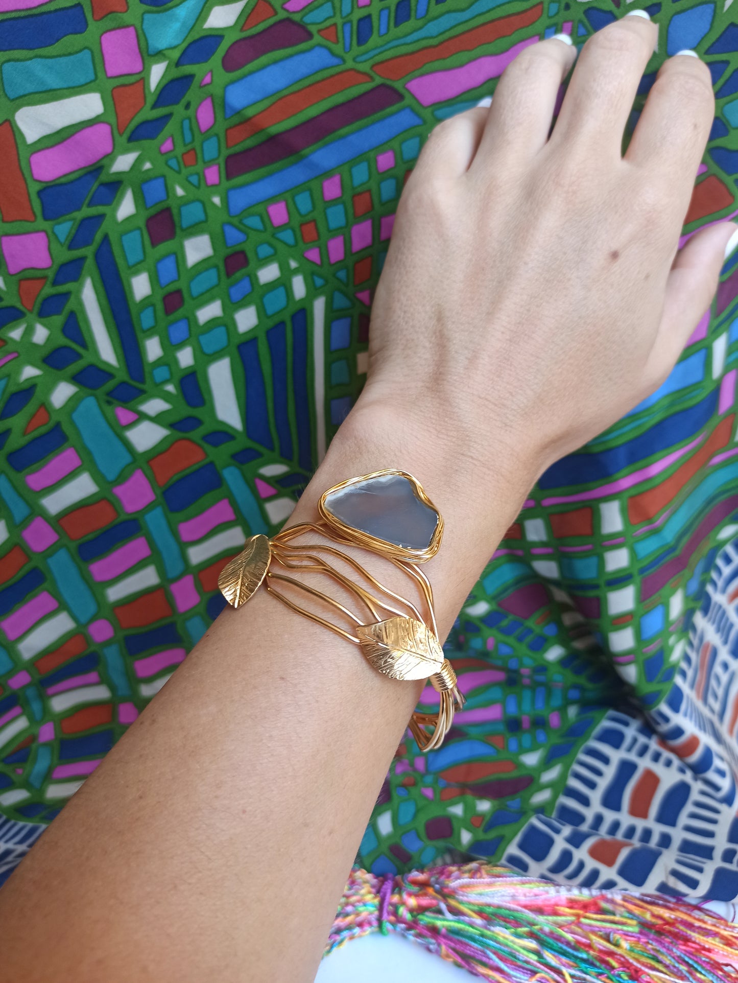 Golden bracelet with light lilac agate leaves