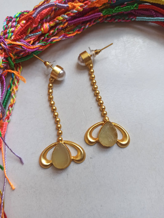 Golden earrings with light green stone