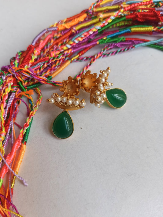 Golden earrings with green beads