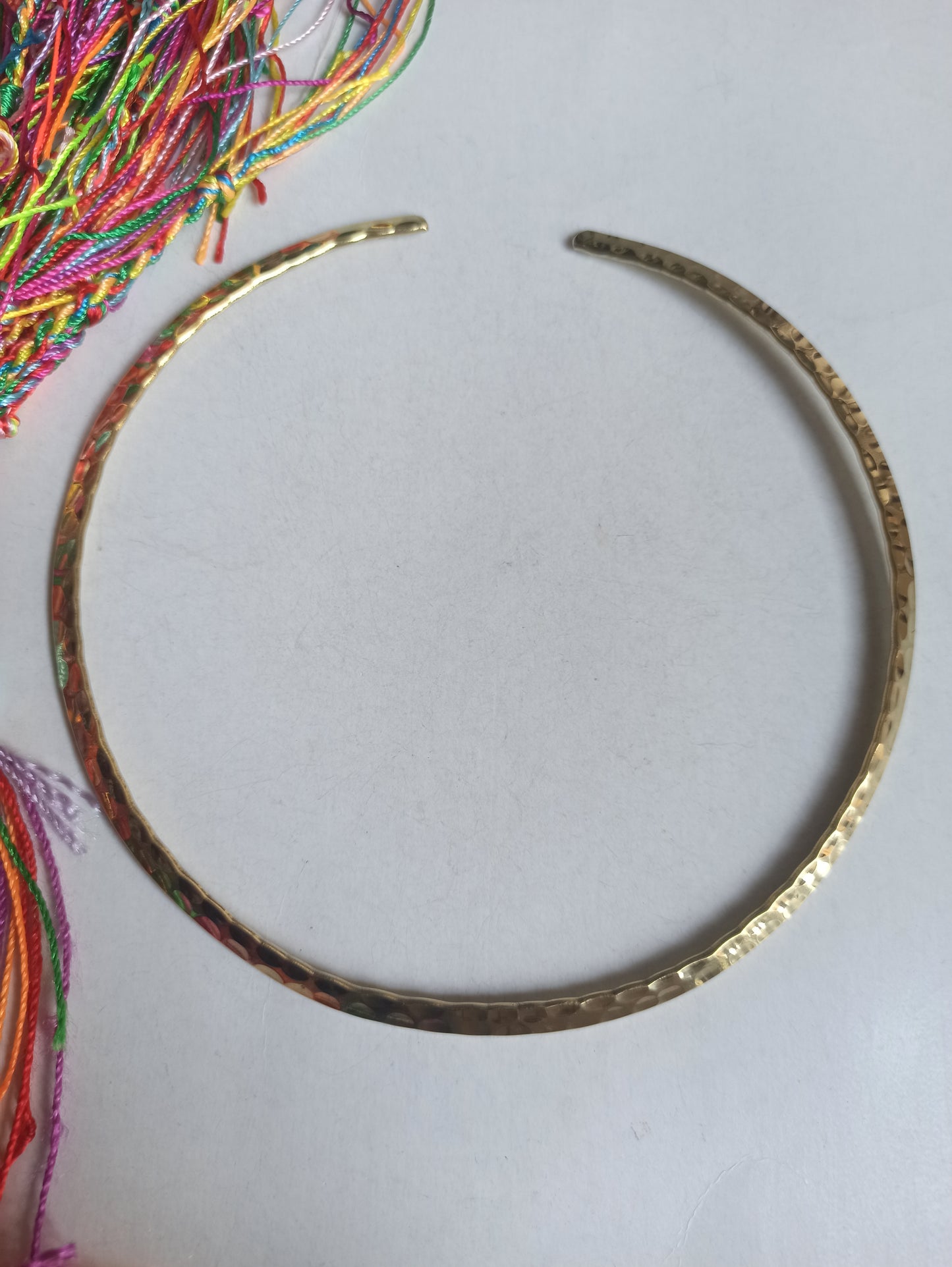 Thin hammered golden collar