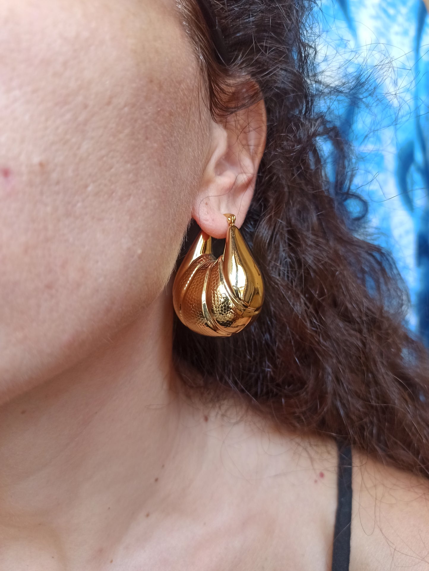 Domed gold steel earrings