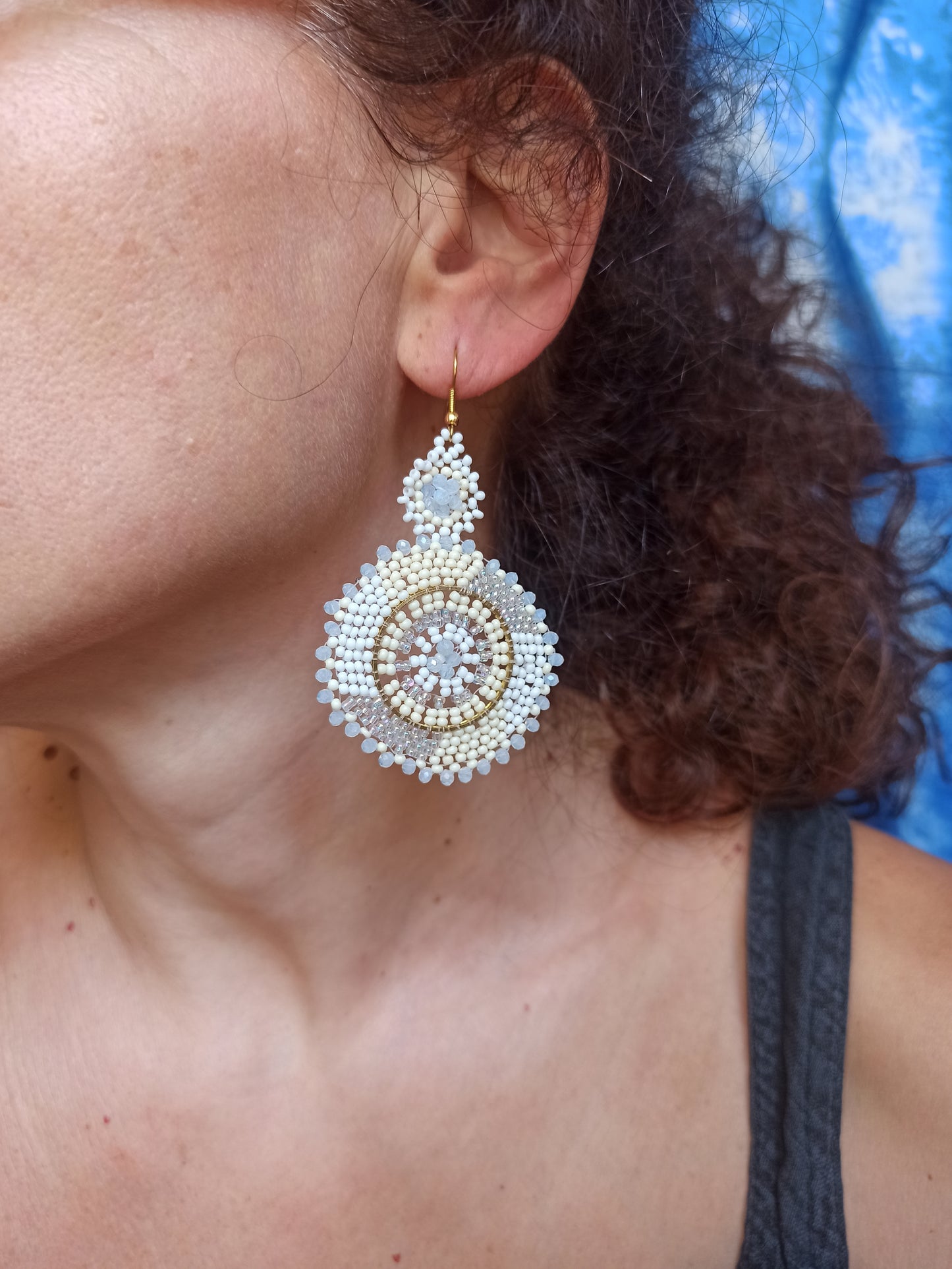 Golden earrings white beads