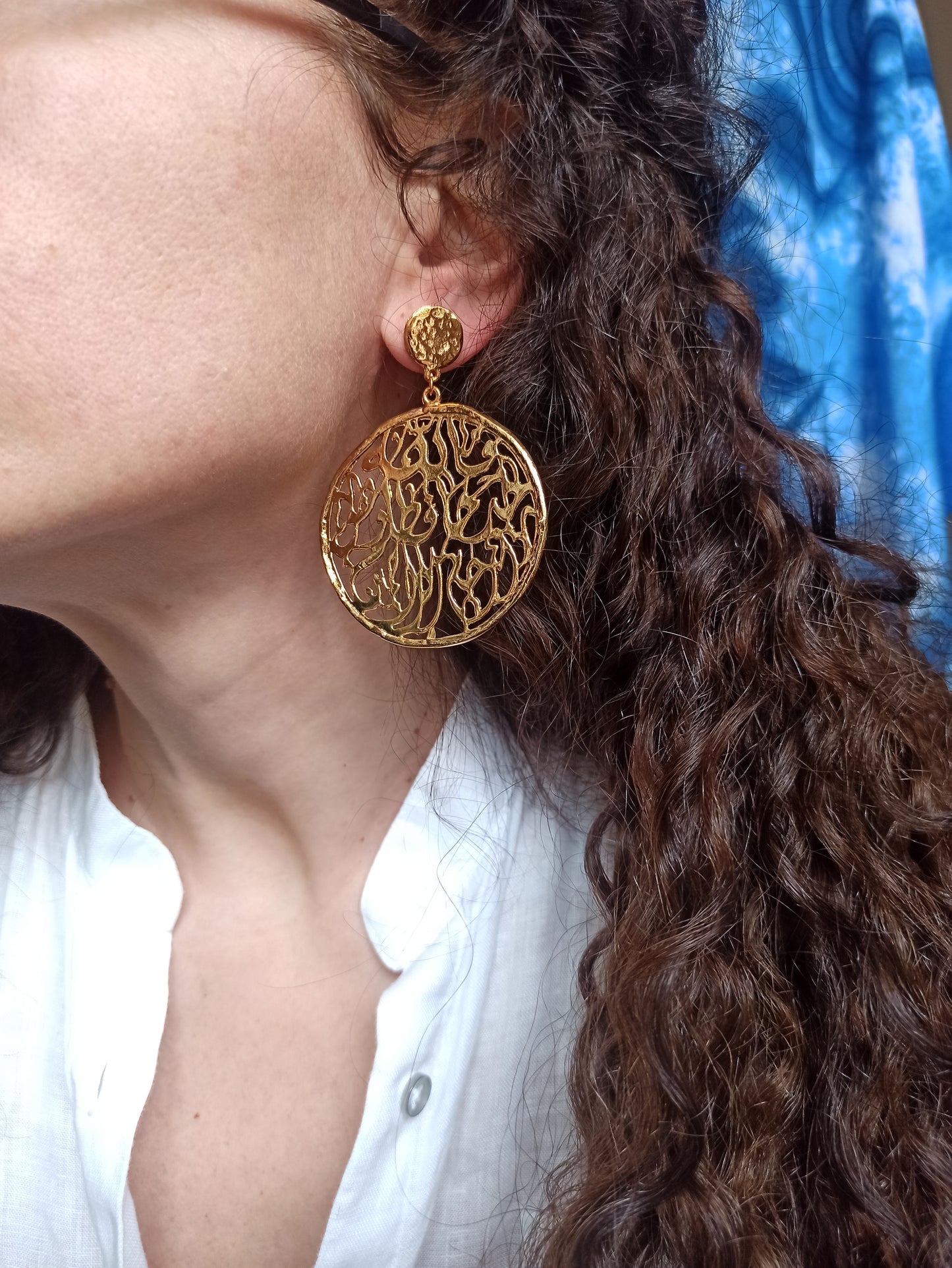 Golden pierced circle earrings