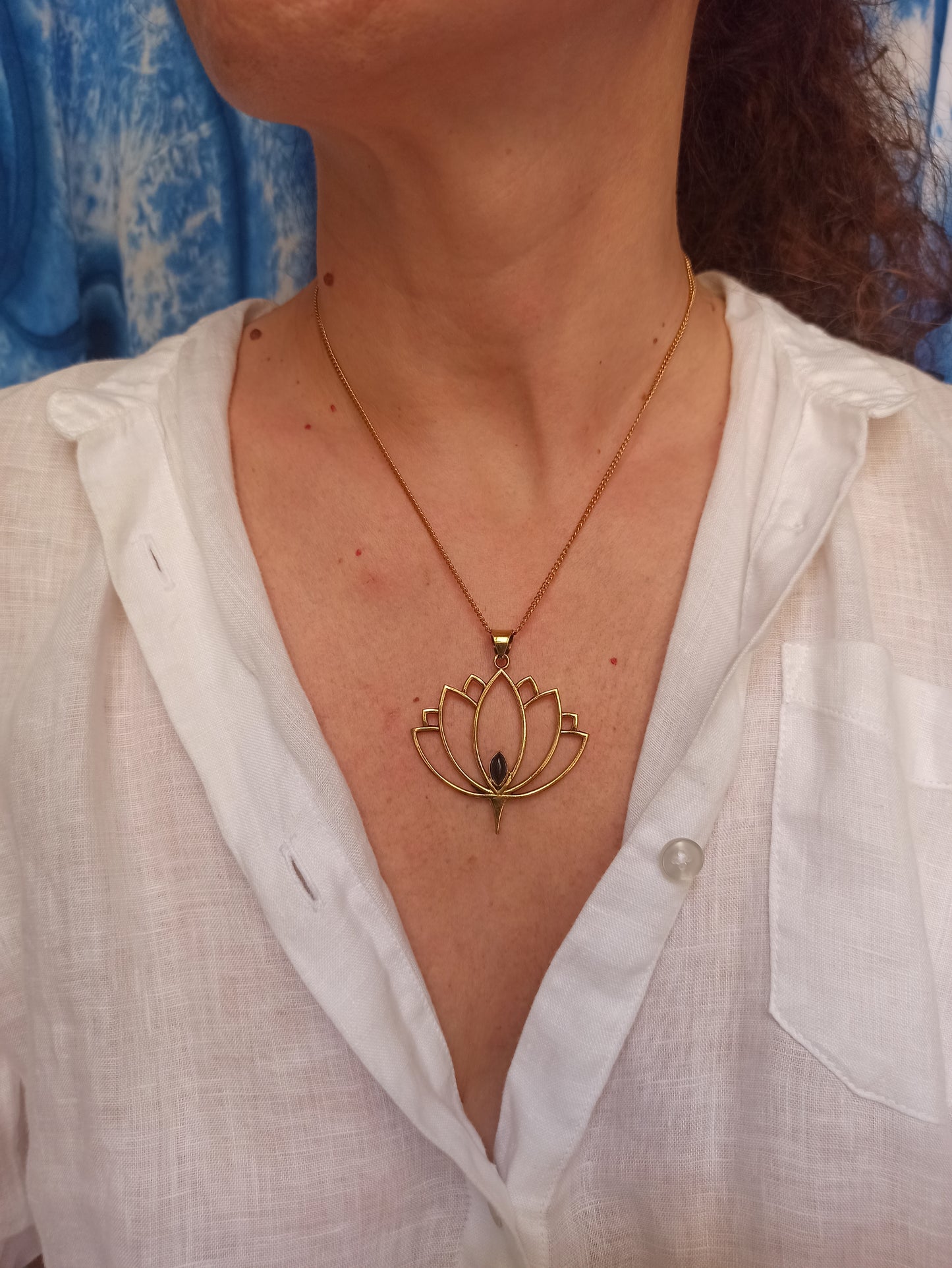 Golden necklace with black onyx lotus flower pendant