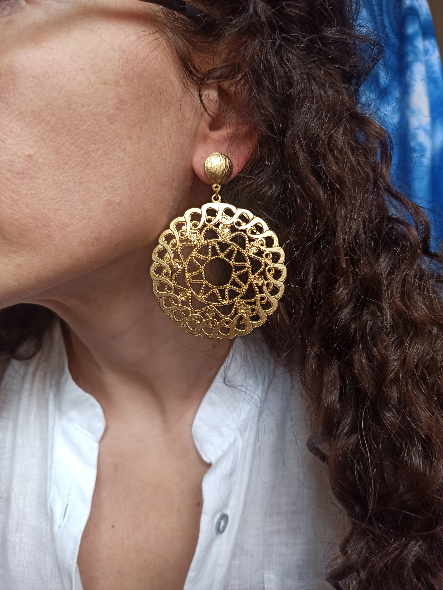 Golden pierced circle earrings