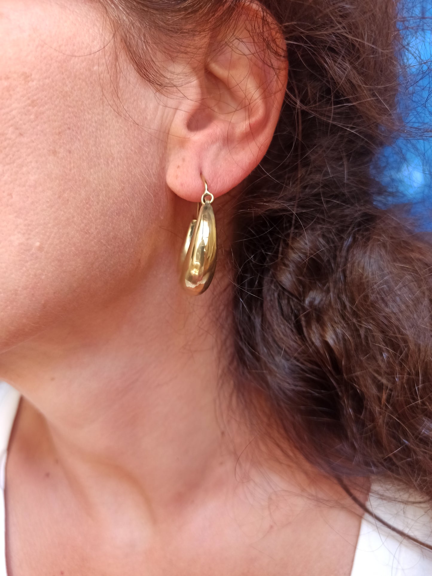 Large rounded golden boho earrings