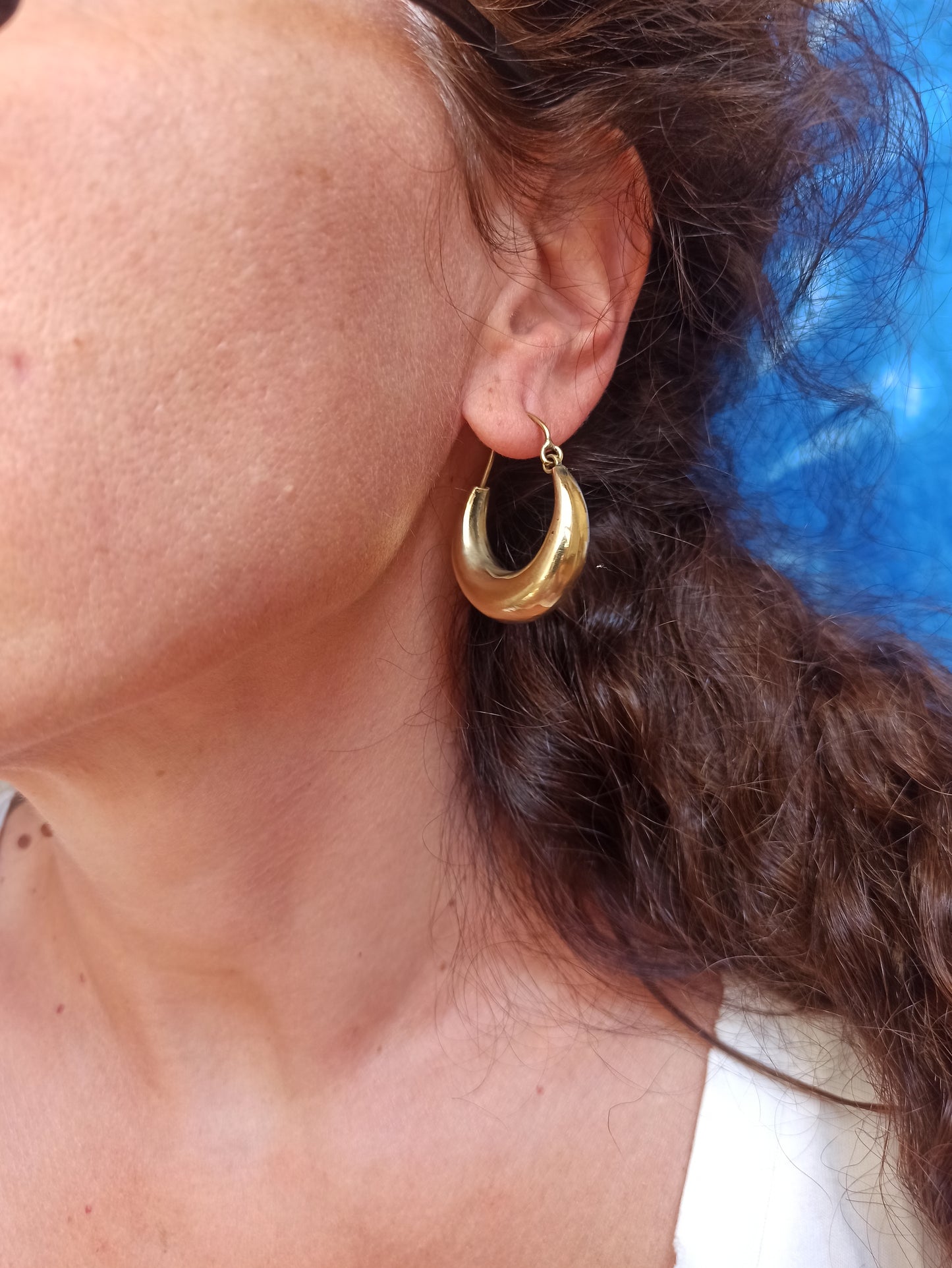 Large rounded golden boho earrings