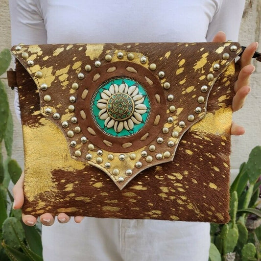 Golden leather shoulder bag with shell medallion