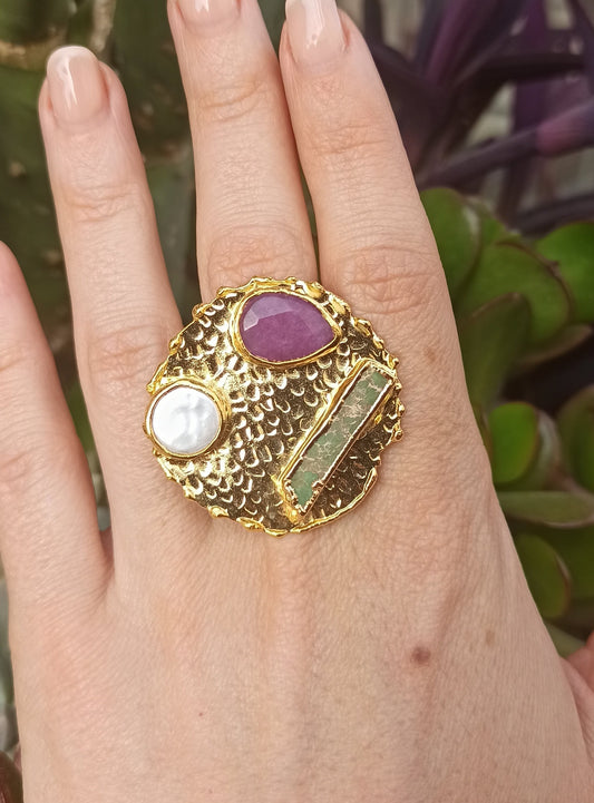 River pearl shield, green agate and purple resin.