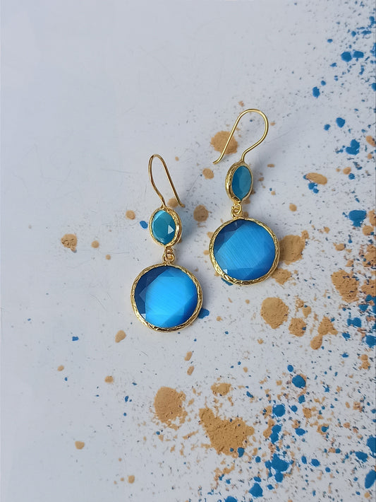 Earrings with 2 light blue stones