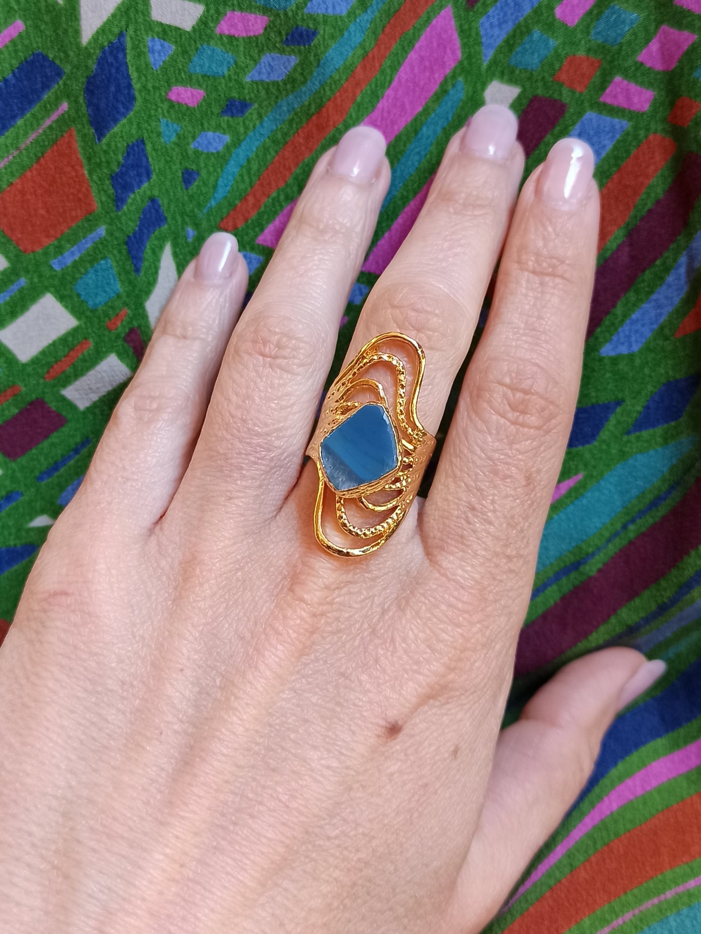 Golden ring with blue agate band