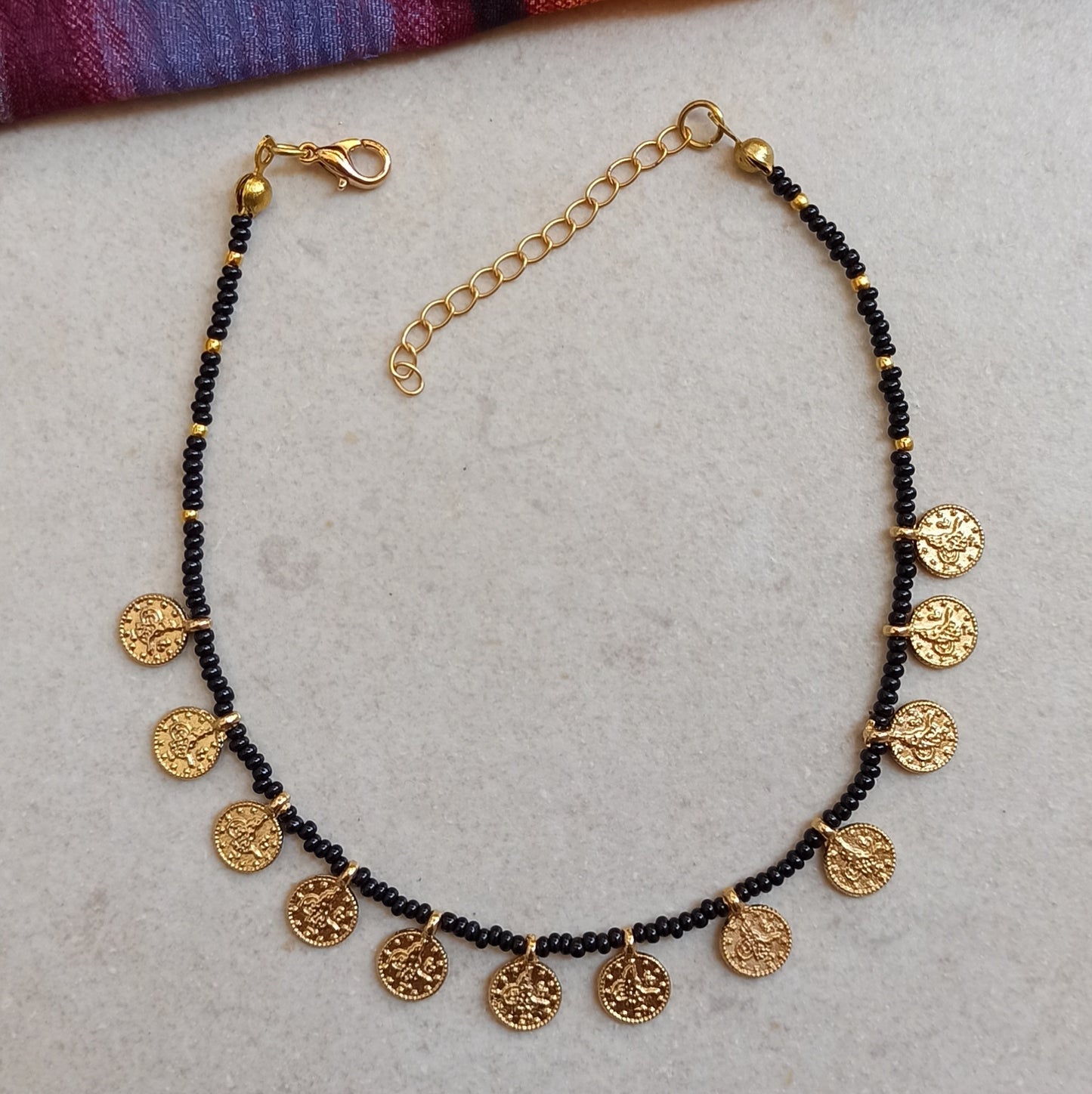 Anklet with black beads + golden coins