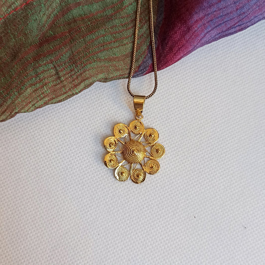 Golden necklace with flower pendant